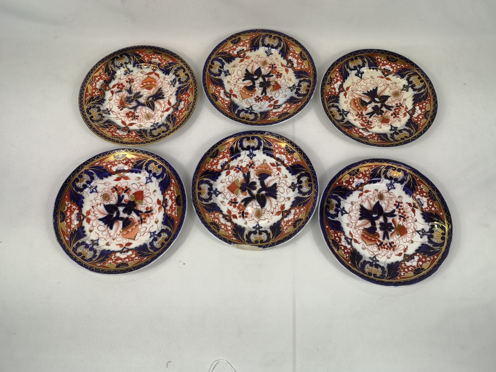 Six decorative plates with gilt highlights