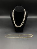 Two pearl necklaces with gold clasps