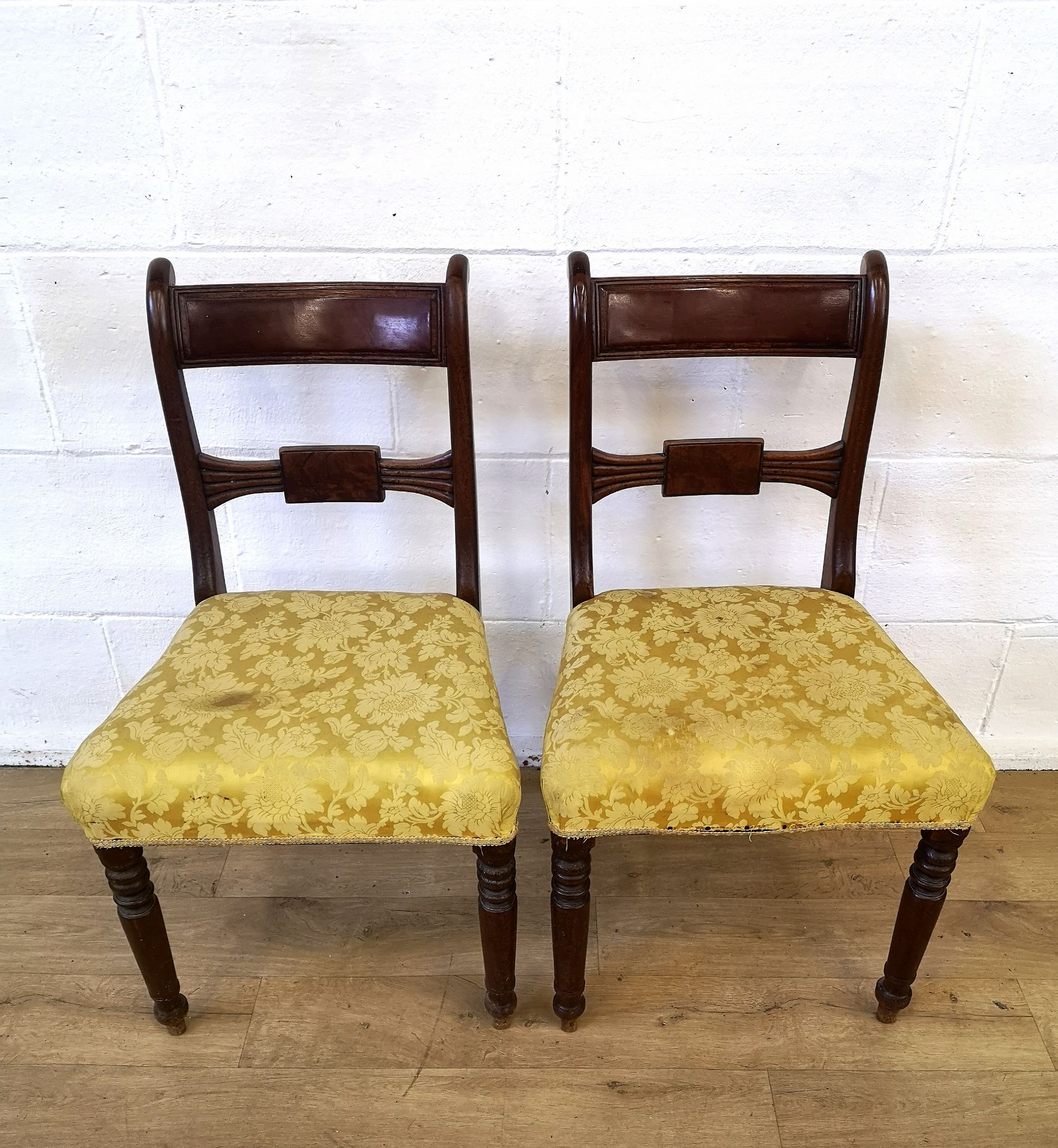 Two mahogany ladder back dining chairs