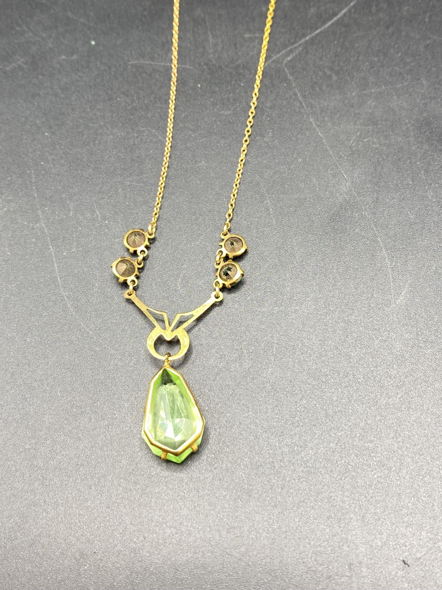 9ct gold necklace set with a pale green teardrop and a 9ct gold diamond set locket - Image 6 of 7