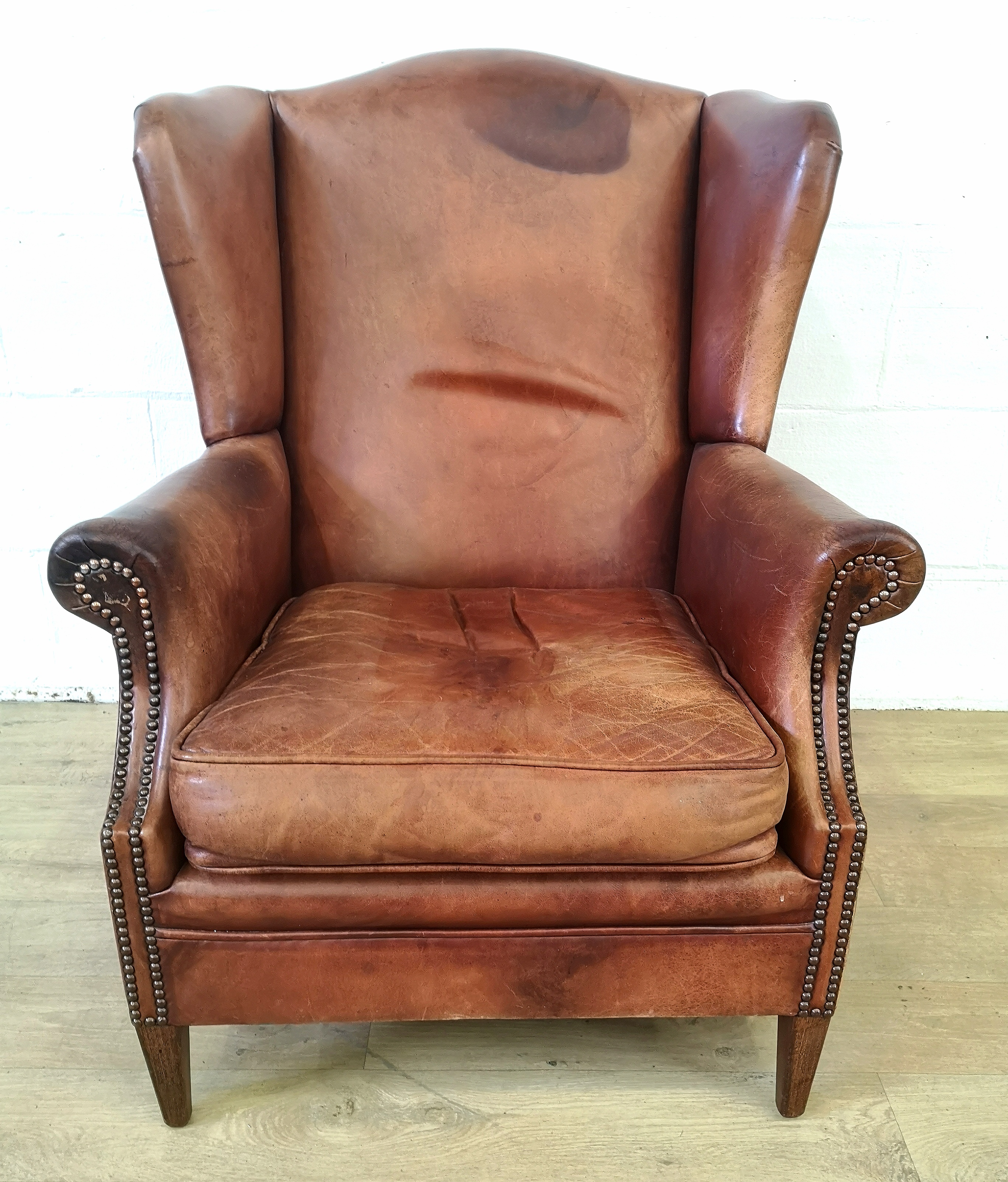 Leather style wingback armchair