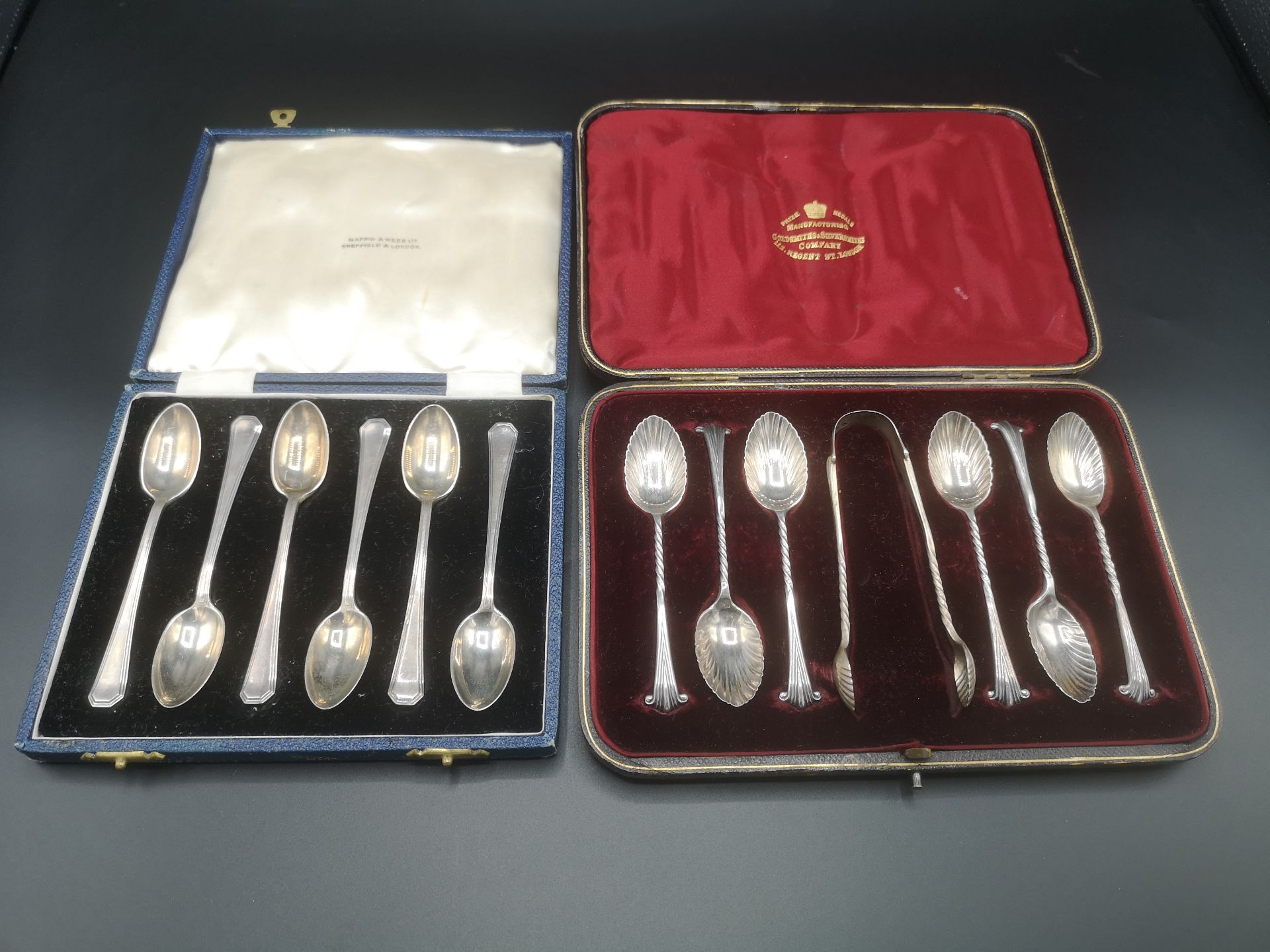 Two sets of silver tea spoons