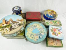 Twelve Huntley & Palmers biscuit tins.