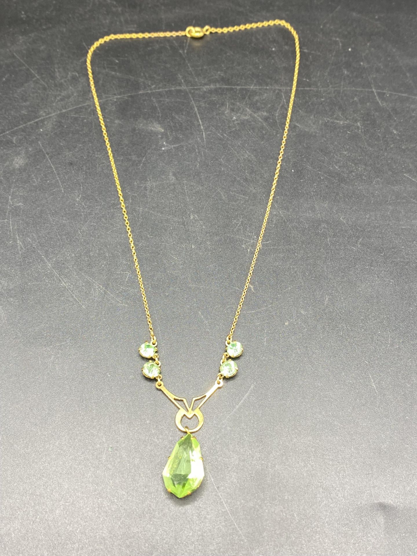 9ct gold necklace set with a pale green teardrop and a 9ct gold diamond set locket - Image 5 of 7