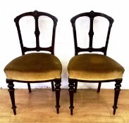 Two mahogany dining chairs with matching carvers