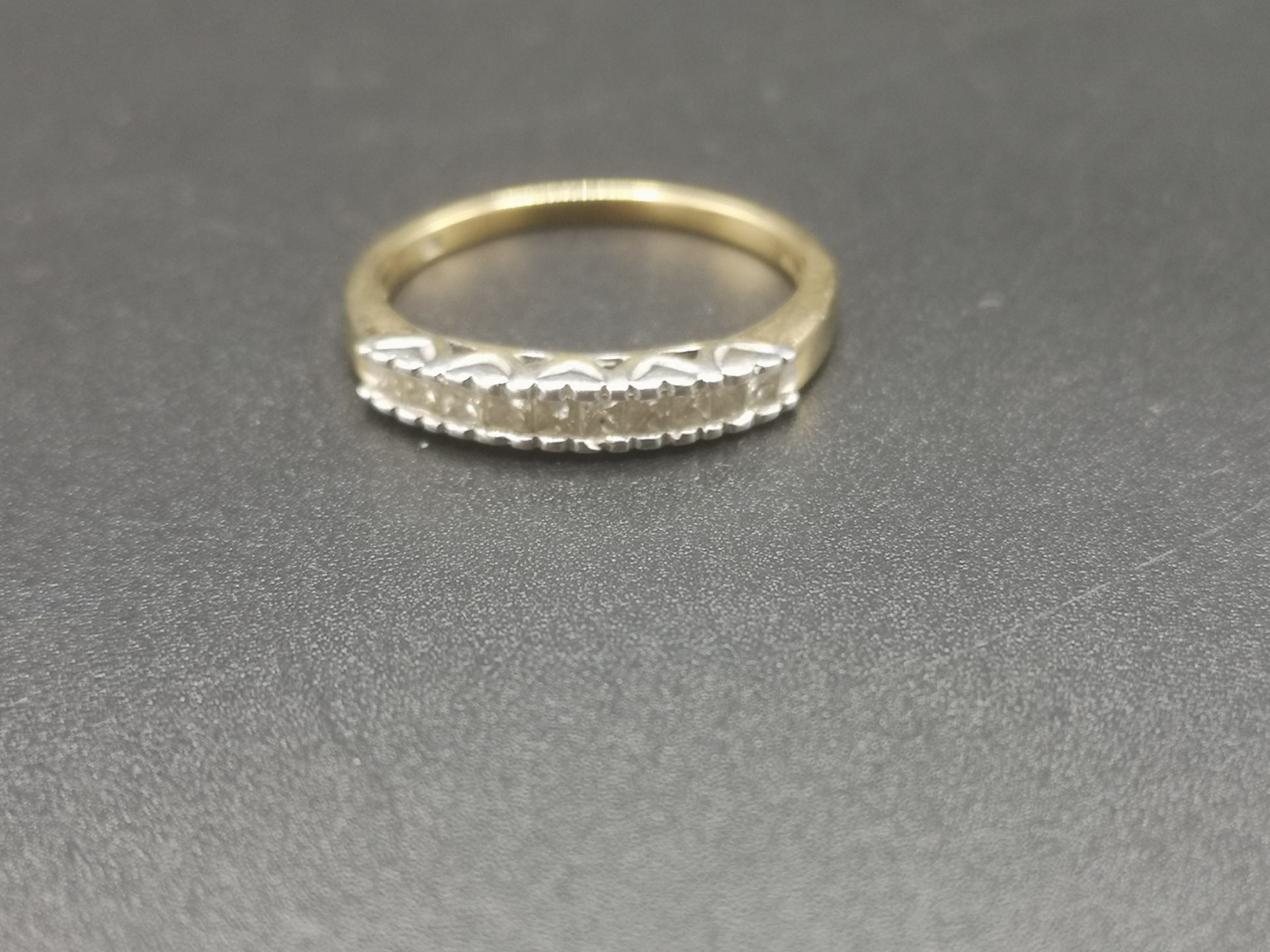 9ct gold ring with channel set diamonds