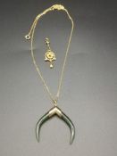 Yellow metal chain and pendant together with a rolled gold pendant
