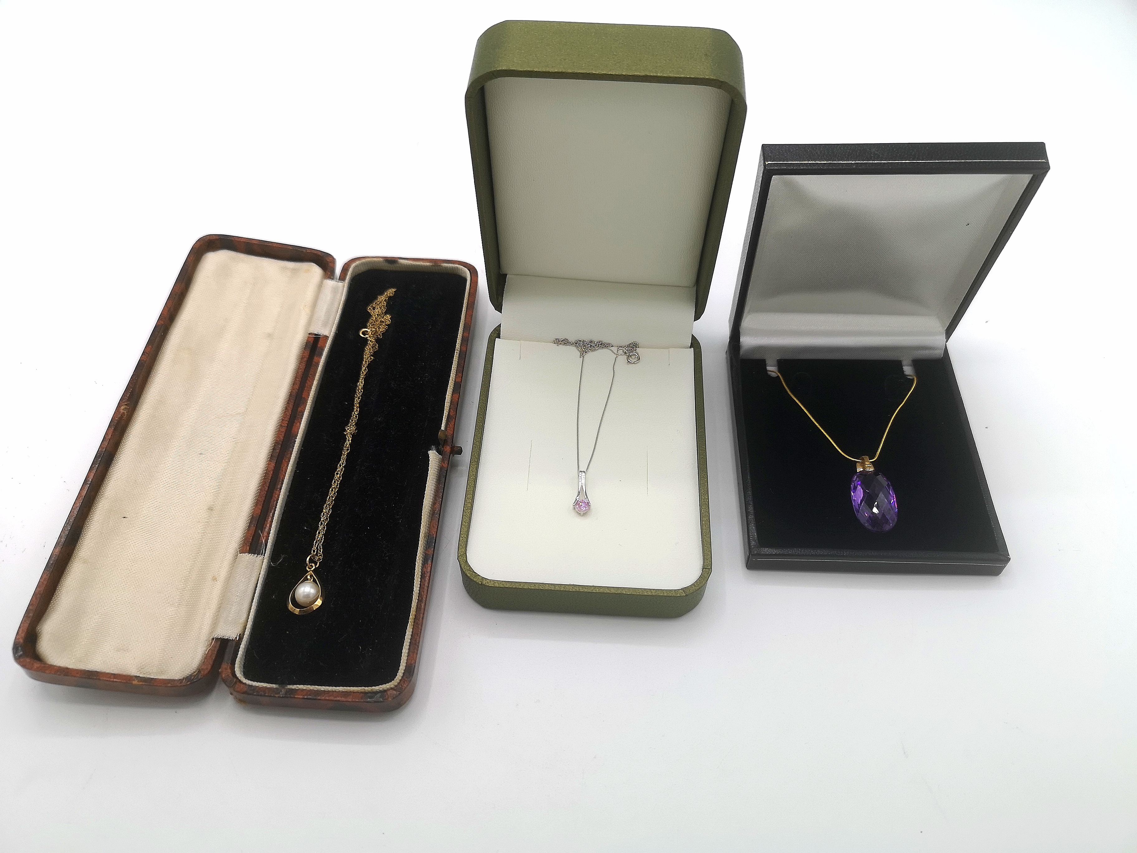 Three 9ct gold necklaces and pendants