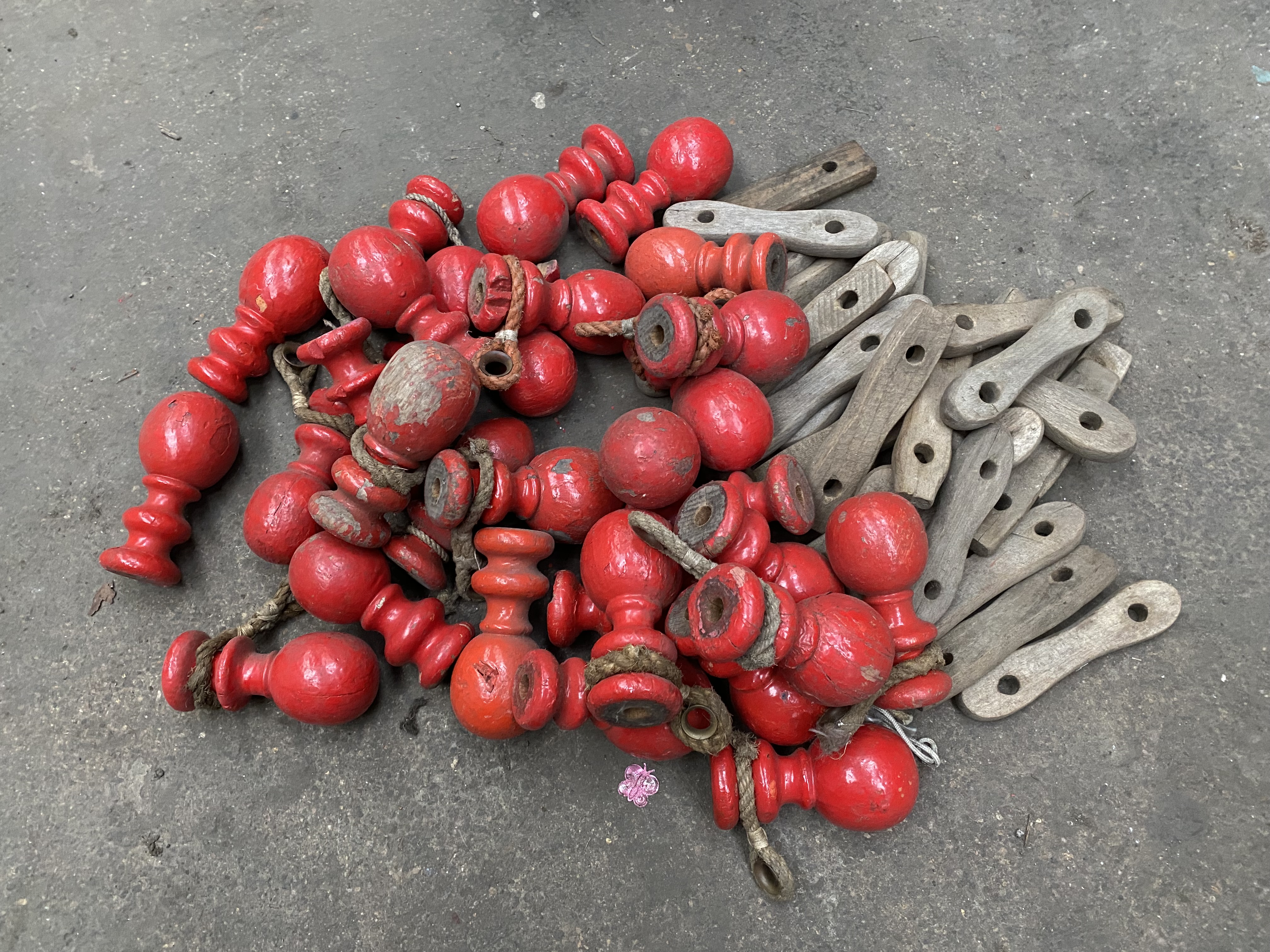 30 small wall pole ornaments and wooden slips. This lot is subject to VAT