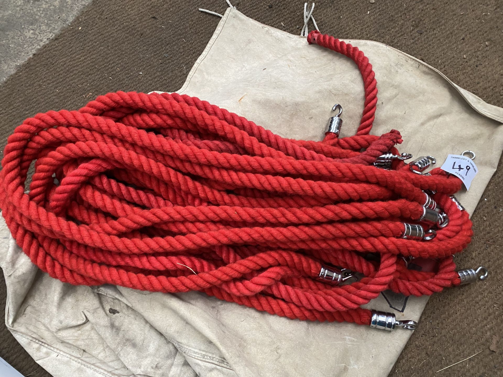 Red barrier rope with chrome hooks. This lot is subject to VAT.