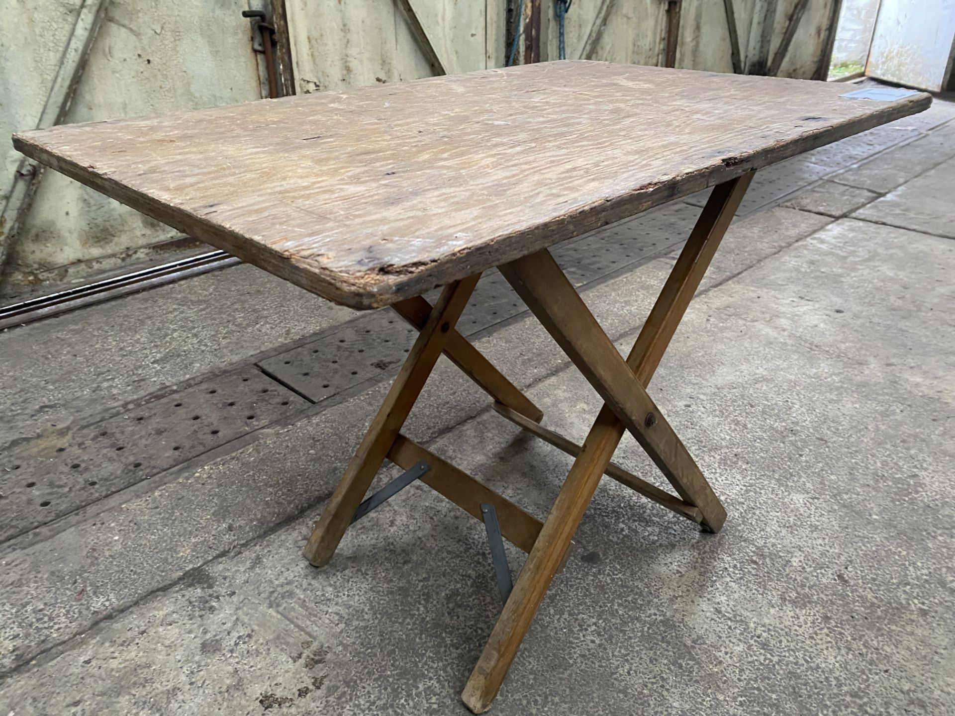 14 no 2ft x 2ft wooden folding tables. This lot is subject to VAT