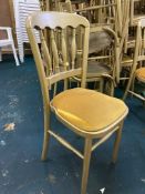 30 gold dining chairs. This lot is subject to VAT.