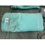 24 x 21ft green PVC tarpaulin, hemmed and eyeleted. This lot is subject to VAT.