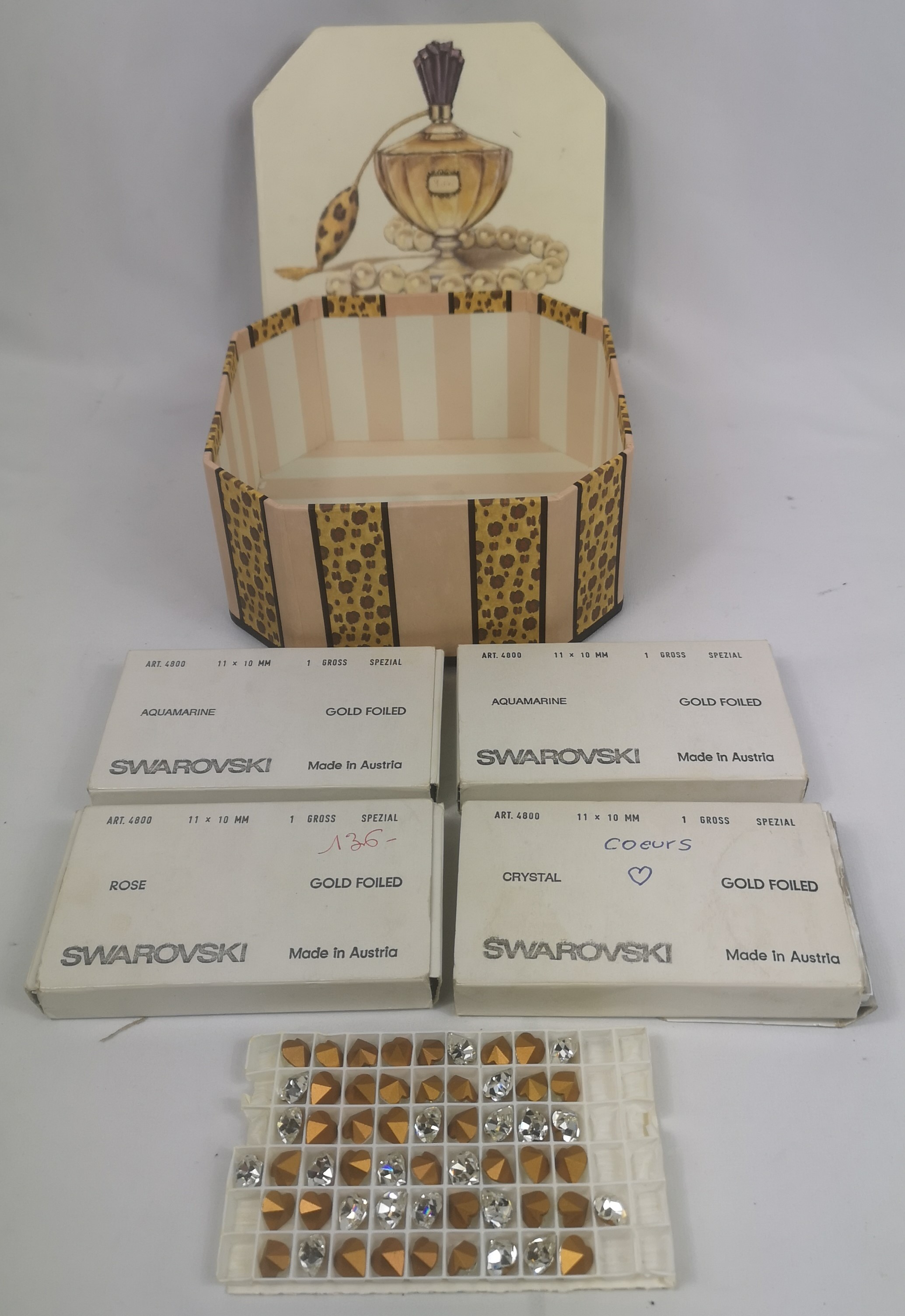 Four boxes of swarovski crystals
