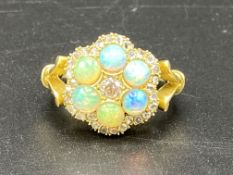 18ct gold ring set with six opals and diamonds