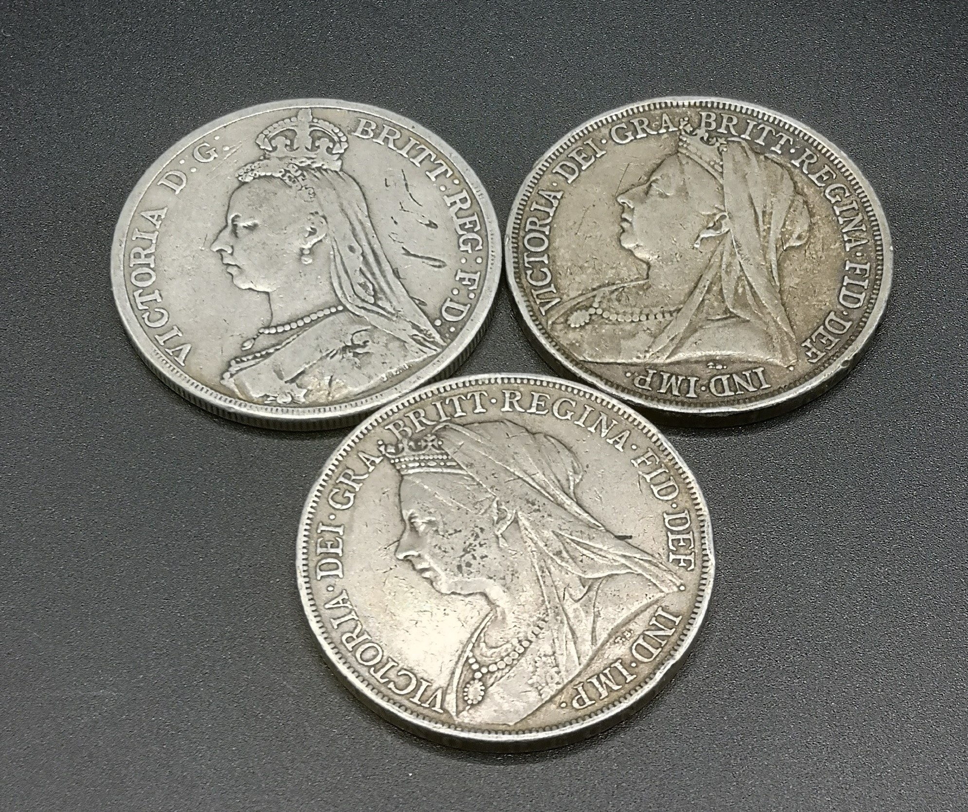 Three Queen Victoria crown coins: 1889, 1893, and 1900
