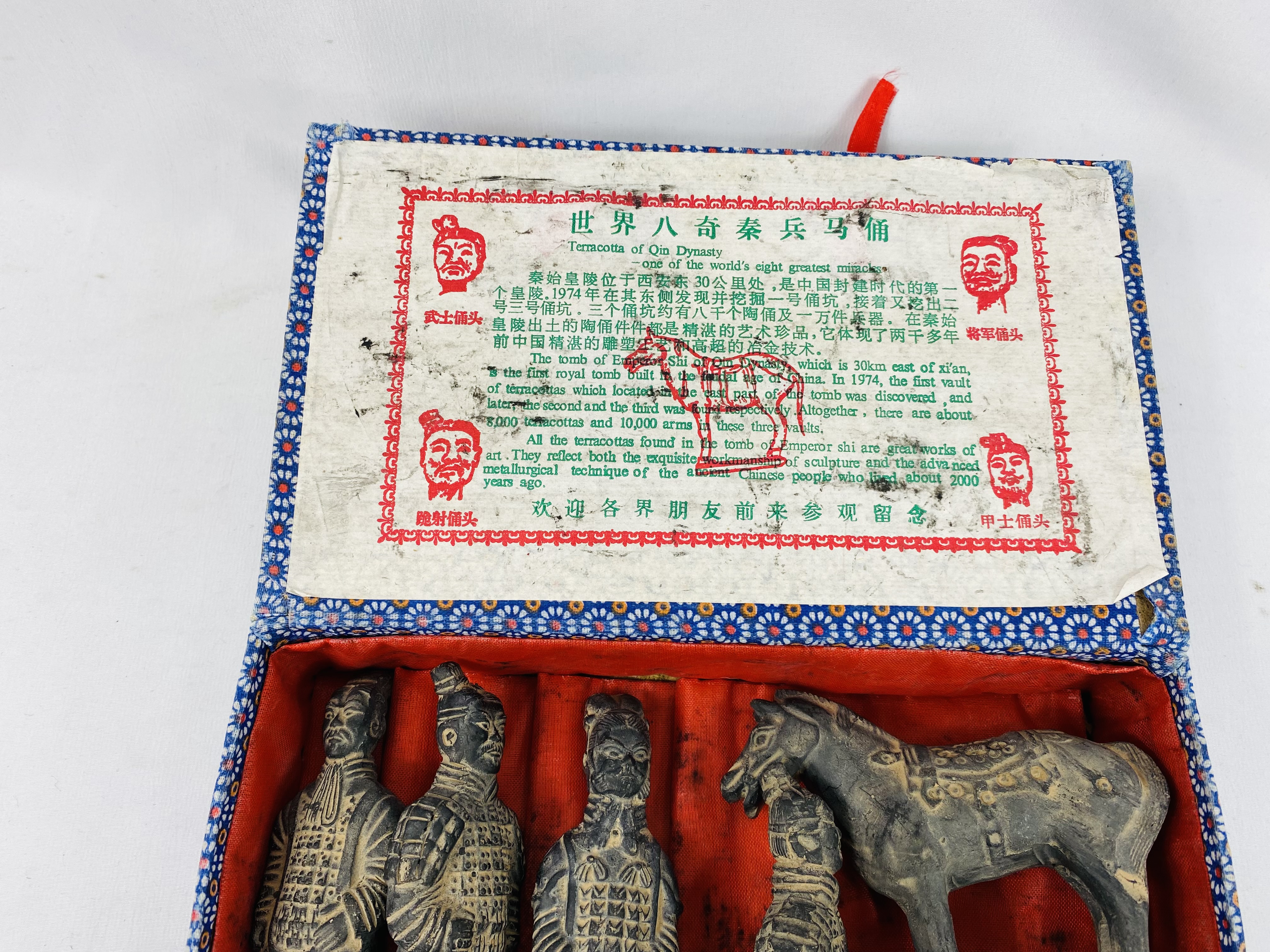 Set of five models of the terracotta army together with a commemorative coin - Image 4 of 4