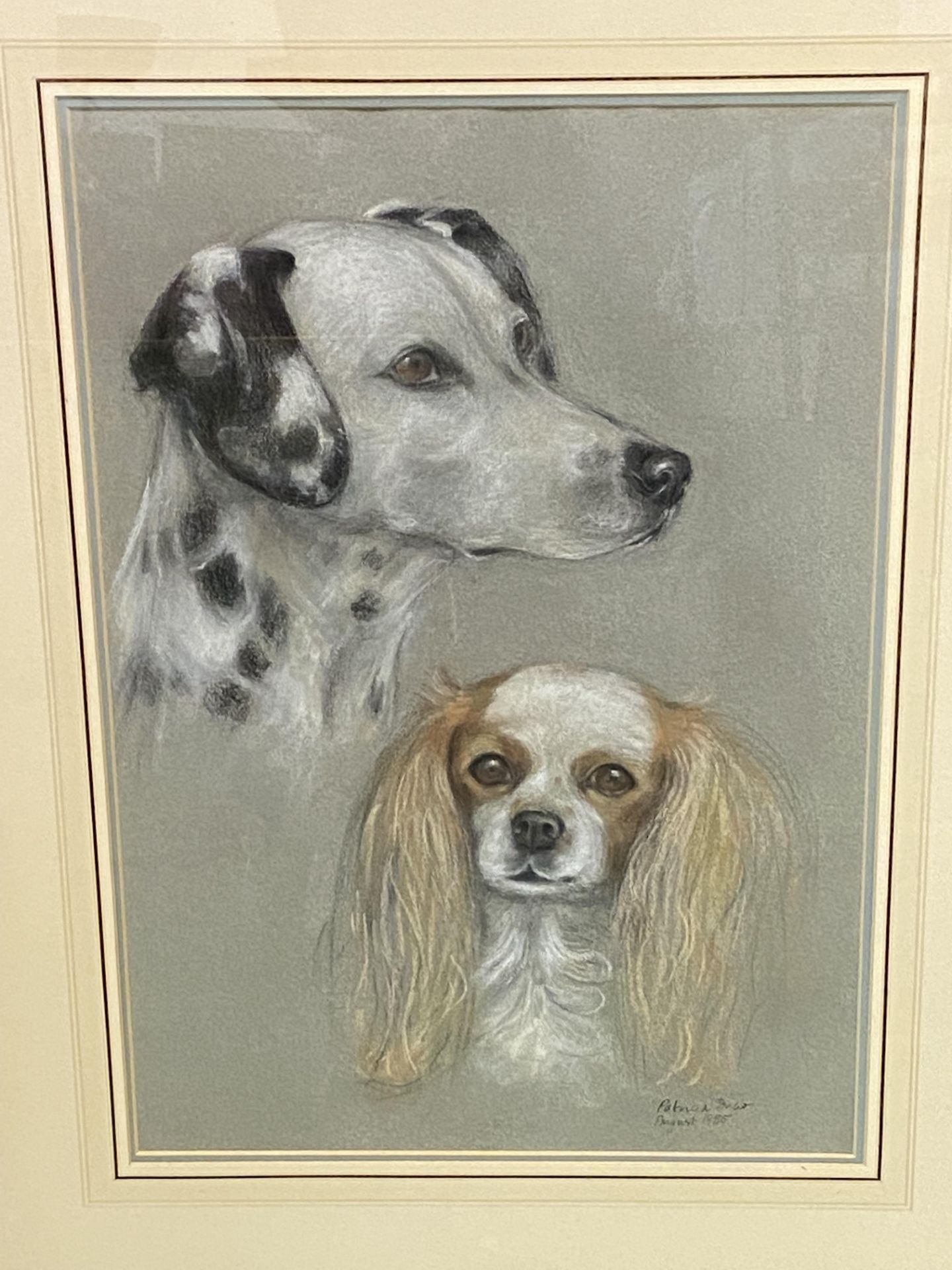 Two framed and glazed pastels of dogs