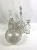 Five glass decanters and a glass wine flagon