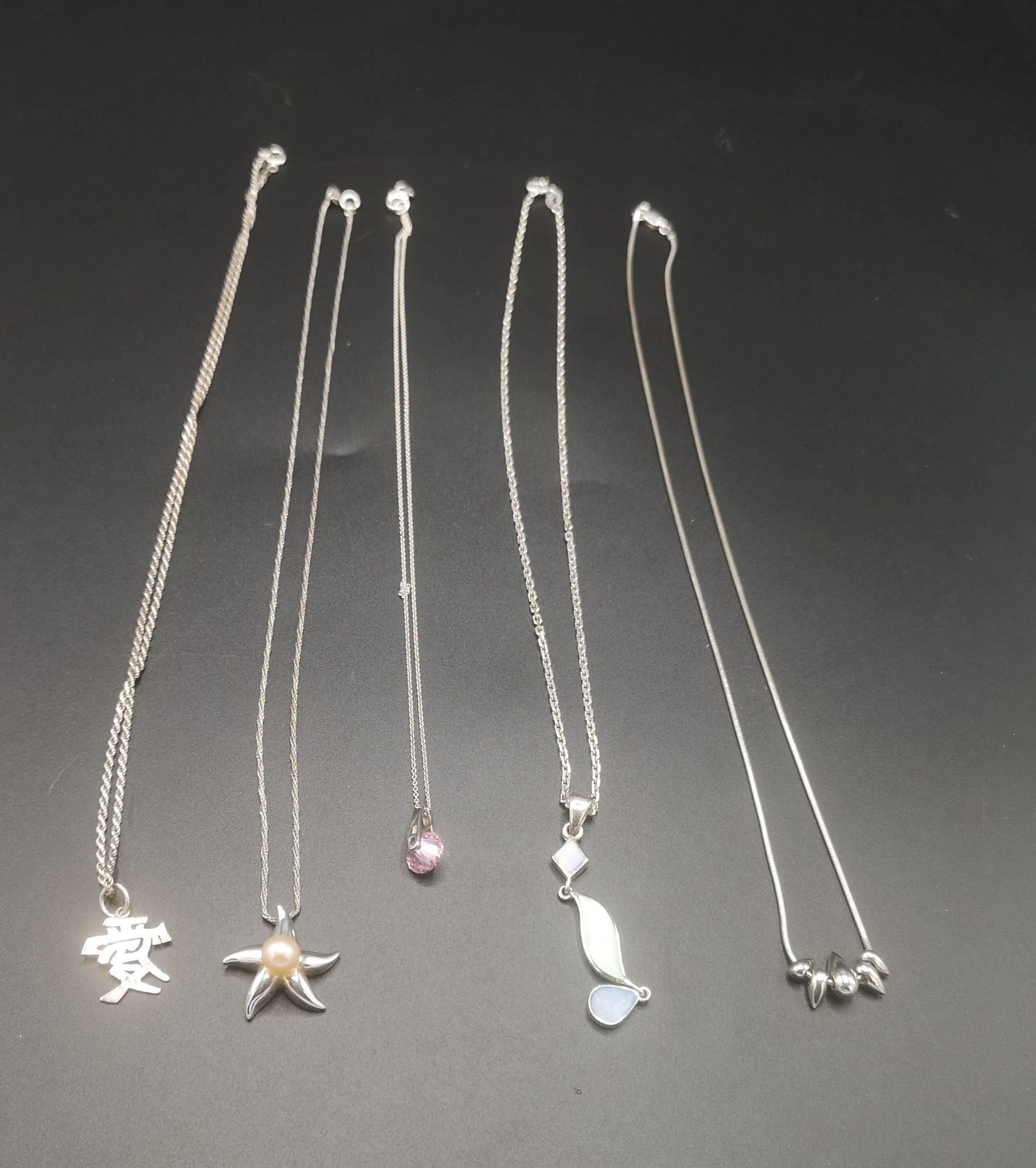 Five silver necklaces