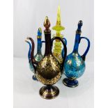 Three Persian rode water bottles together with a yellow glass decanter