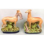 Two Victorian Staffordshire hand painted hunting dogs