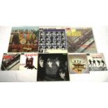 Four Beatles EP's together with four Beatles LP's