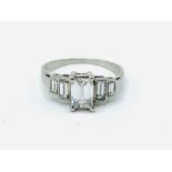 Platinum five stone emerald cut diamond ring