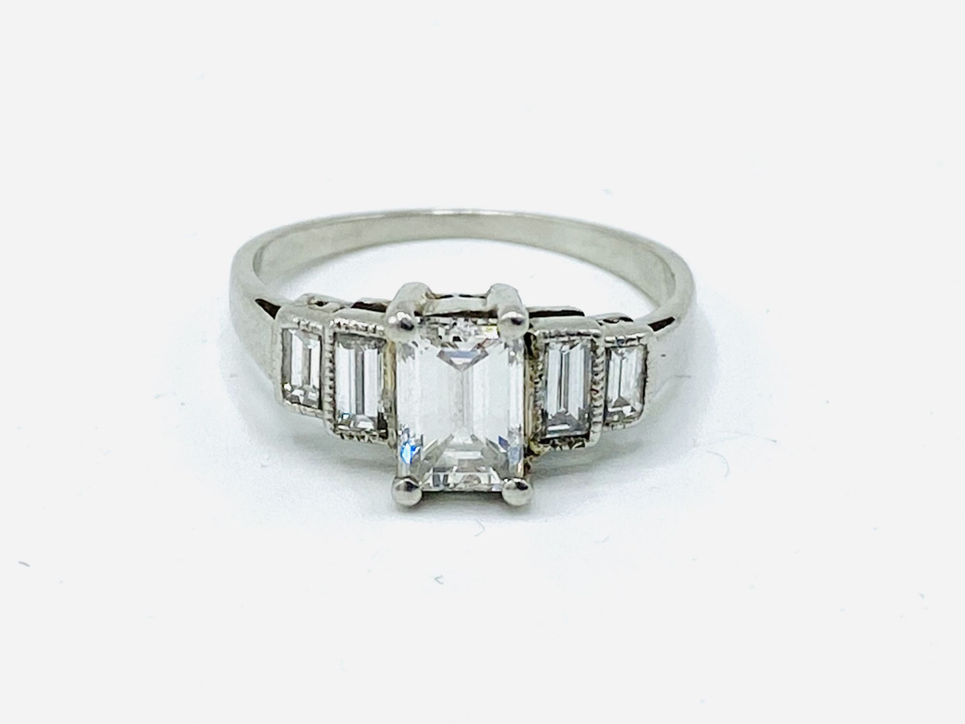 Platinum five stone emerald cut diamond ring