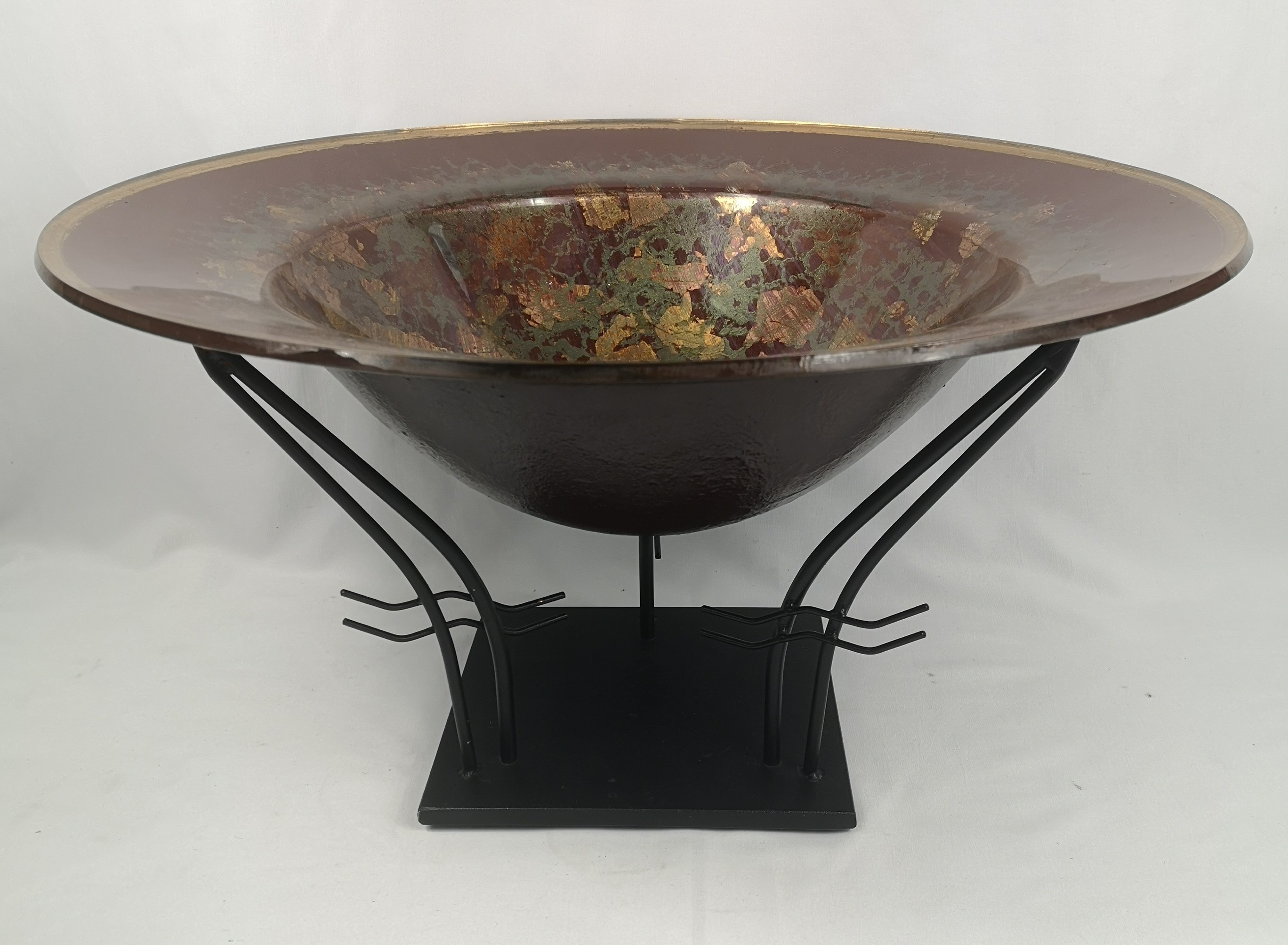 Art glass bowl on metal stand
