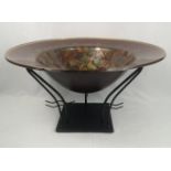 Art glass bowl on metal stand