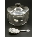 Silver tea caddy and spoon
