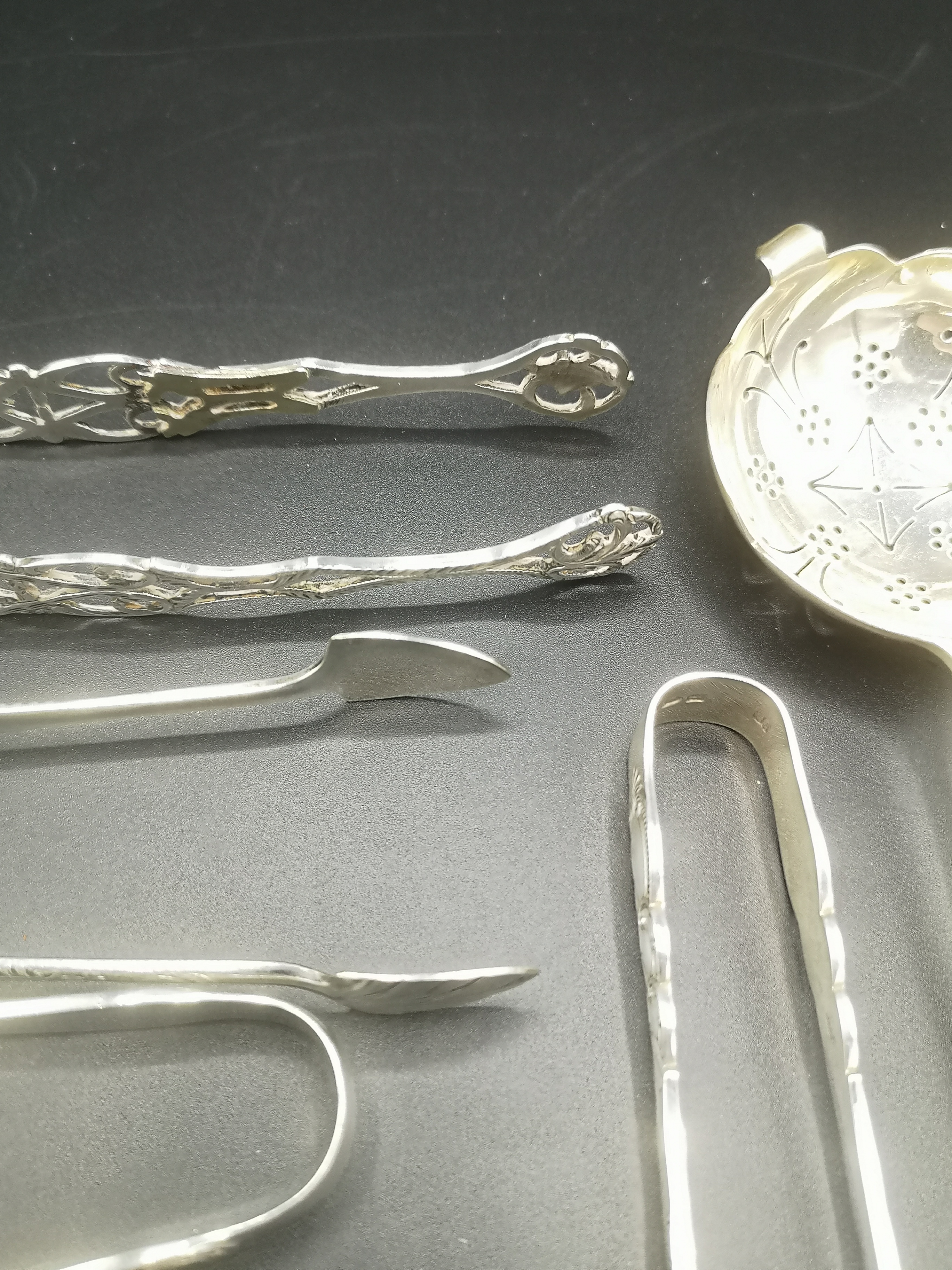 Silver tea strainer with other silver spoons together with silver plate sugar tongs - Image 2 of 10