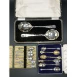 Twelve silver and white metal souvenir spoons