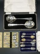 Twelve silver and white metal souvenir spoons