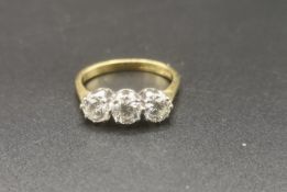 18ct gold and platinum, three diamond ring