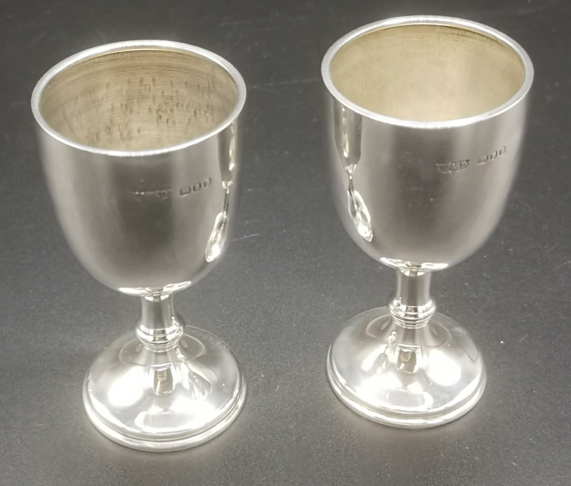 Two silver cups and a silver pill box