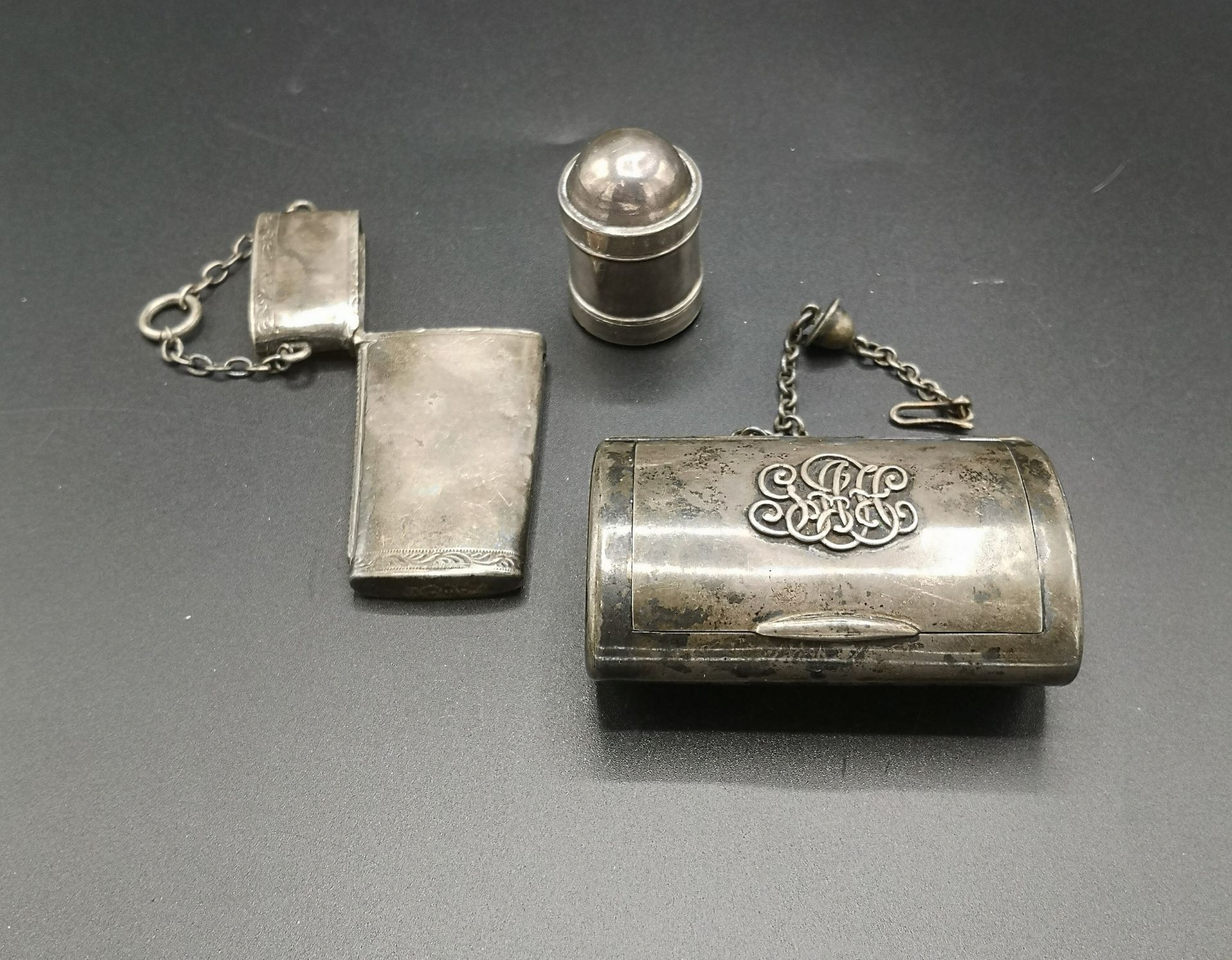 Georgian silver nutmeg grater, Victorian silver cigarette case and a silver venta case