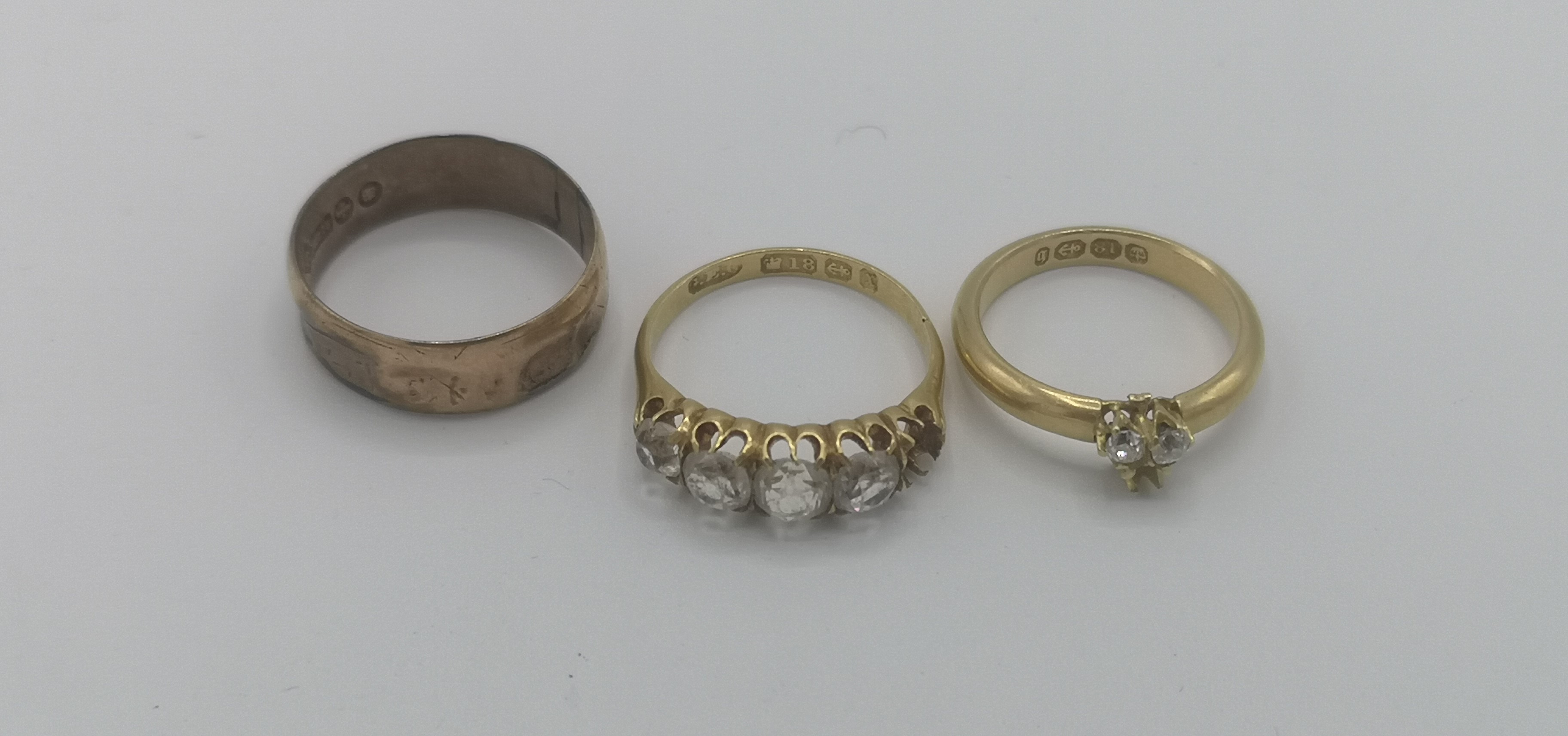 Two 18ct gold rings together with a 9ct gold ring