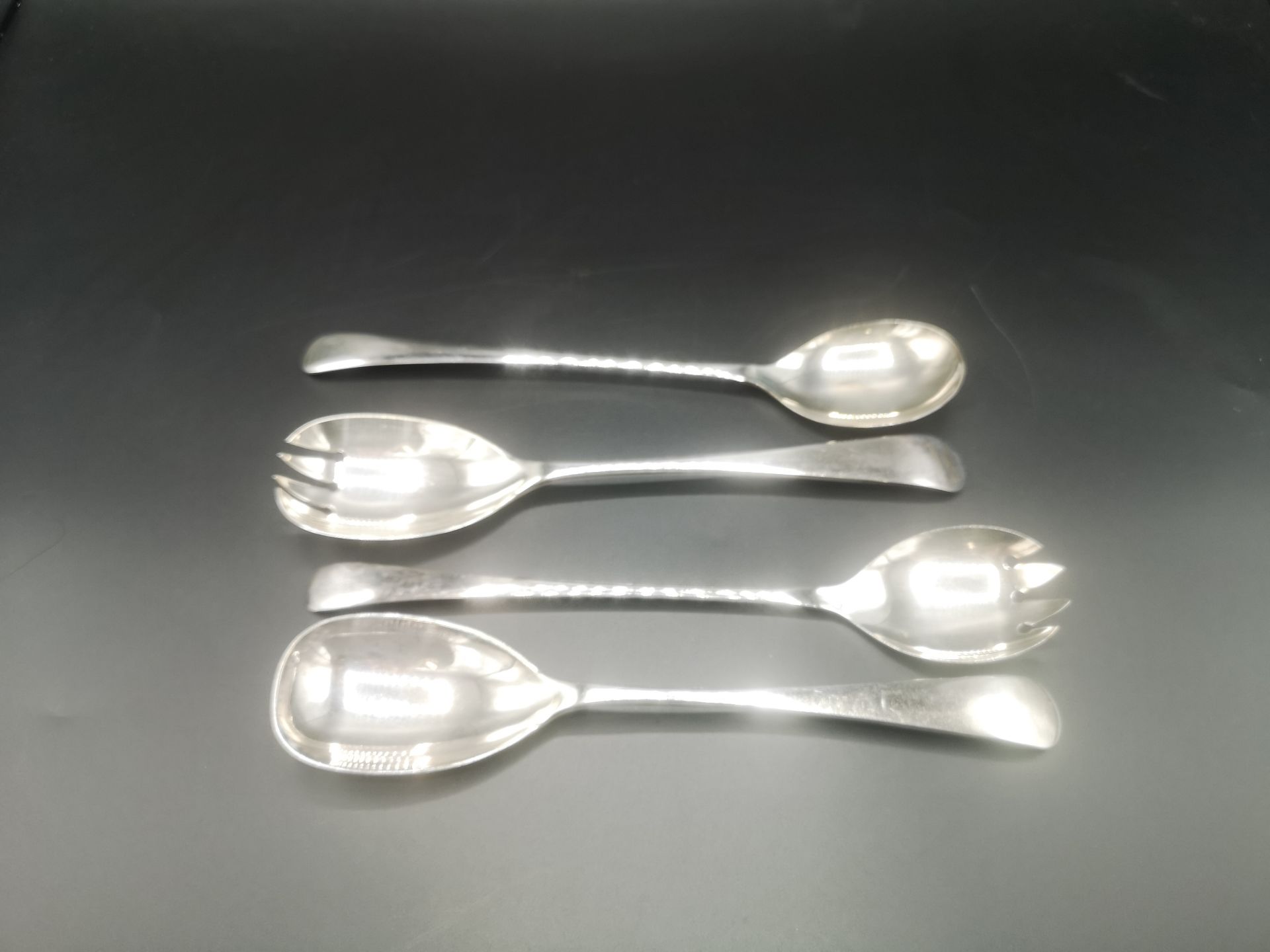 Two pairs of silver plate salad servers