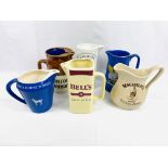 Six ceramic advertising water jugs