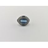 9ct gold ring set with a central blue stone