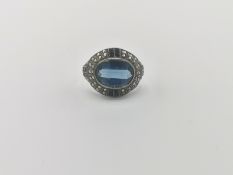 9ct gold ring set with a central blue stone