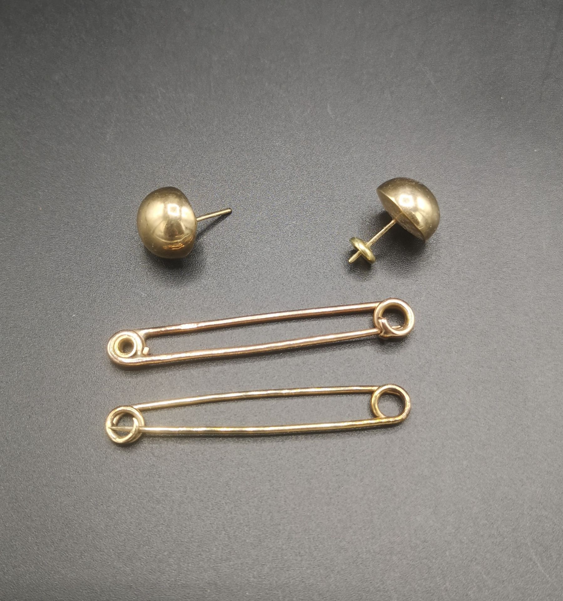 Pair of 9ct gold earrings together with a 9ct gold safety pin