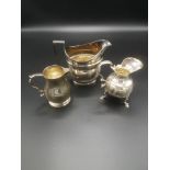 Two Georgian silver jugs together with a Victorian silver jug
