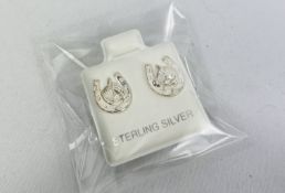 125 pairs of 925 silver horse earrings.