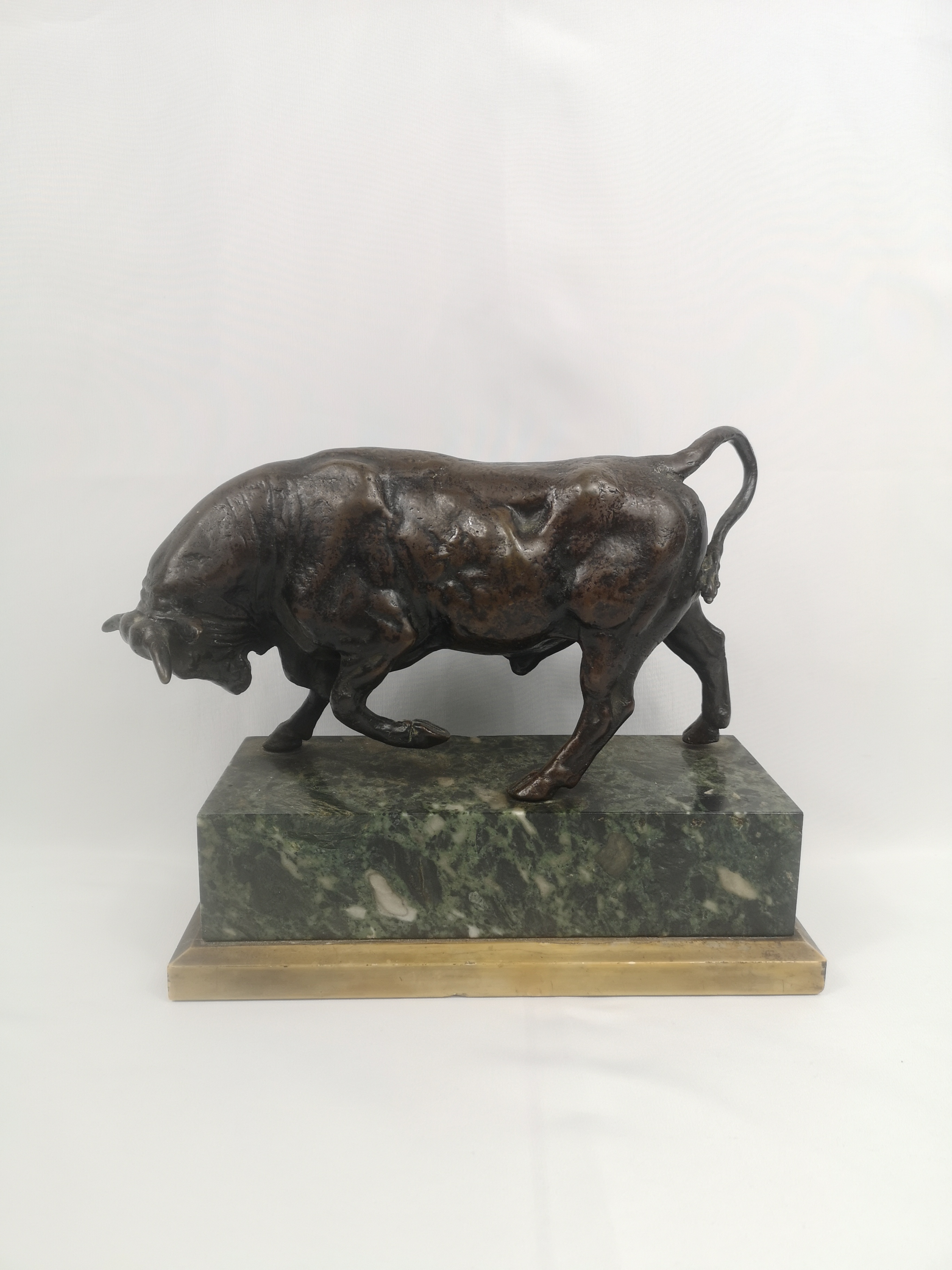 Bronze bull on marble base