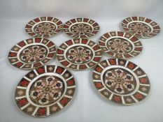 Eight Royal Crown Derby Imari pattern side plates