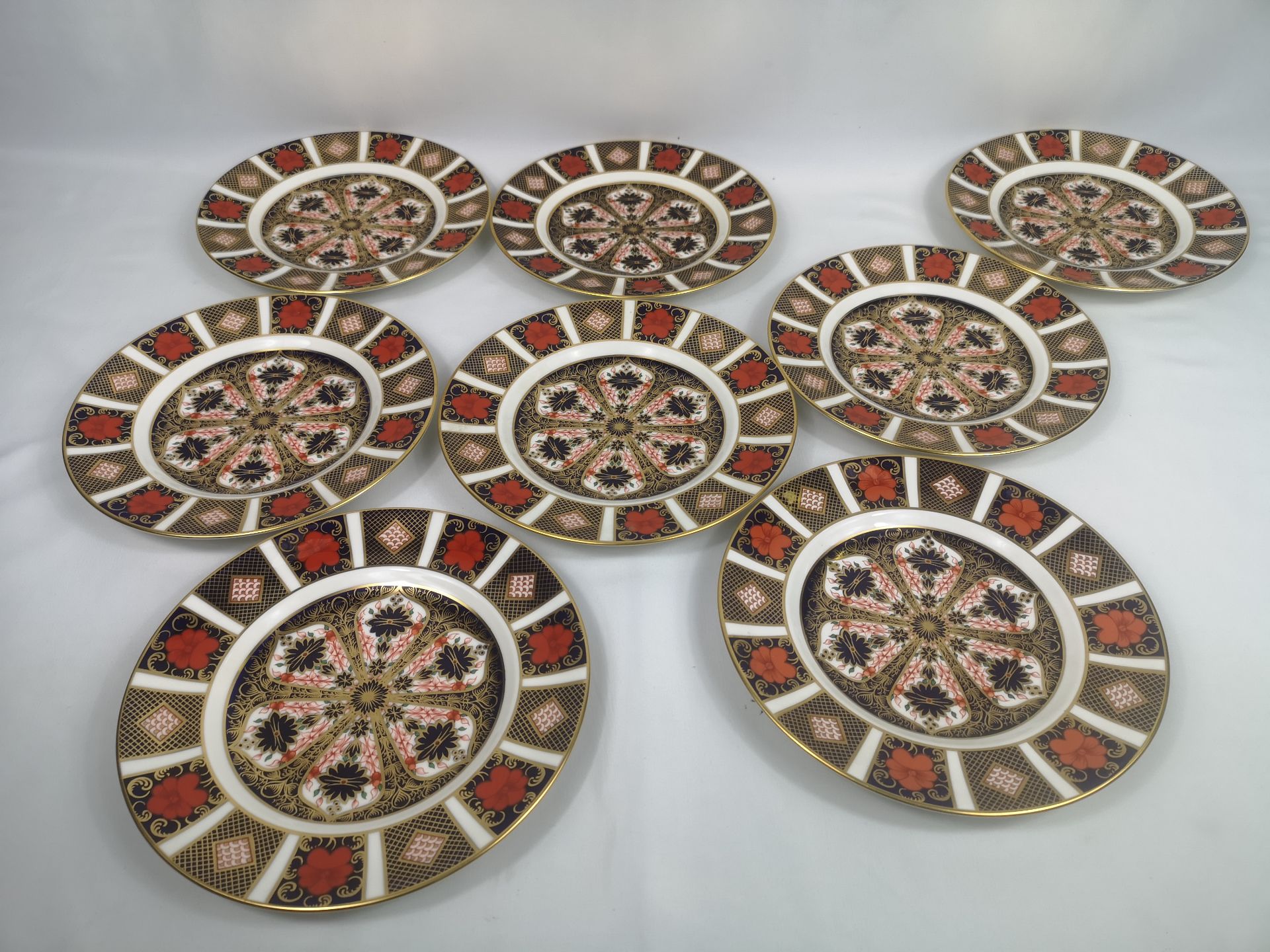 Eight Royal Crown Derby Imari pattern side plates