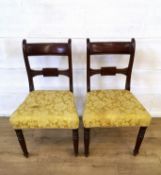 Two mahogany ladder back dining chairs